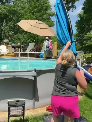 We added a canaliever umbrella next to our pool so we can swim in the shade or under the solar lights at night. #cantileverumbrella #poolumbrella #poolshade #outdoorliving #backyardsetup 