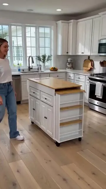 🤯 Transform your kitchen with this smart extendable island! It goes from 80" down to 48" to fit your space perfectly. Enjoy an extended dining table for meals or prep, plus a built-in power outlet for all your gadgets. With 2 storage drawers and 3 open shelves, keeping your kitchen organized has never been easier. Plus, it's mobile – roll it wherever you need extra counter space or serving versatility! Available in multiple colors to match your style. Tap to shop this kitchen essential! #KitchenIsland #HomeOrganization #DealsForYouDays #AIGC #Moras