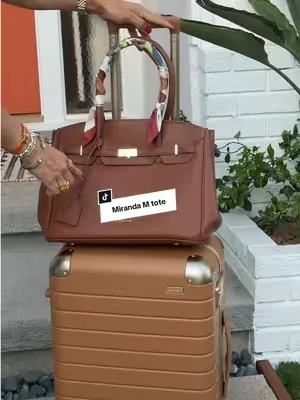 Gorgeous Miranda M tote that holds it all! Magnetic closure and slides on carry on for travel too. #dealsforyoudays #tiktokshopcreatorpicks #leatherhandbags #leathertravepurse #designerpurses@Newbella.Fashion 