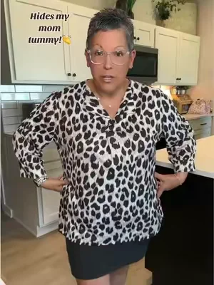 I love how this top hides my mom tummy! And the leopard print is so cute! #plussizetops #leopardprinttop 