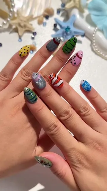 🐠 Dive into something different. Our fish-inspired press-on nails are fun, unique, and handmade with love.  #PressOnNails #FishNails #NailTok #HandmadeNails #Cutenails 