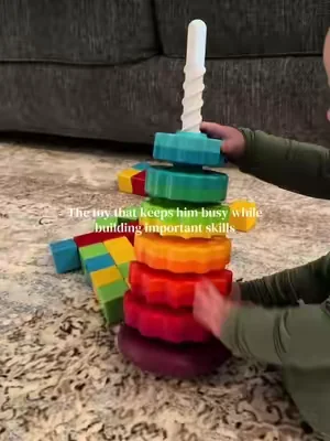 My 9 month old is obsessed with this toy!! We love educational toys 🤍 #stackingtoys #stacking #babytoys #toddlertoys 
