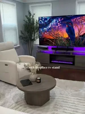 I have an 83 inch tv on it and it fits perfectly there’s soooo many LED colors to choose from too! It arrives in 2 separate boxes one for the glass fire place and the other shipment had the tv stand so one box may arrive before the other 🤍@amazonpukami #fireplace #tvstand #livingroomdecor #livingroomfurniture #homedecor 
