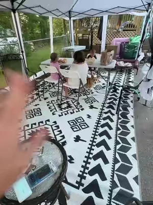 This @Outsunny outdoor rug is HUGE!  I love the pattern and that it fits my extra large canopy.  This rug comes in sizes up to 9x18!  #outdoorliving #outdoorrug #patiorug #backyardsetup 