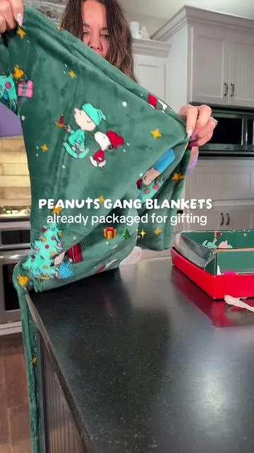 These Peanuts Gang blankets are so adorable and make a perfect gift.  #snoopy #charliebrown #charliebrownchristmas  #peanutsgang #cozygift 