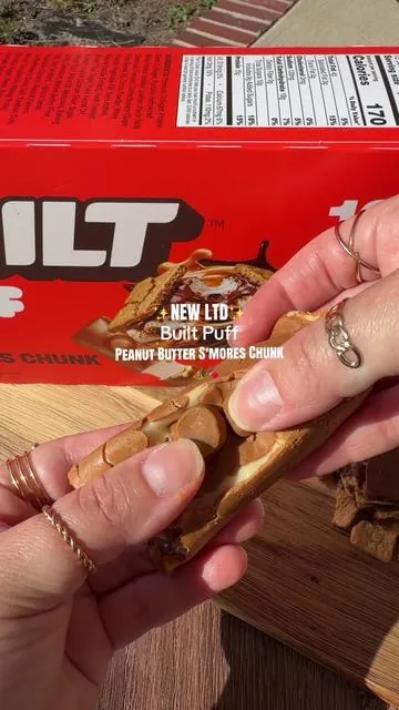 The new BUILT Puff Peanut Butter S’mores Chunk flavor is finally here! If you love soft marshmallow, peanut butter, chocolate, and s’mores flavors, this limited-edition protein bar is one to grab before it sells out. Plus, it has 15g of protein and collagen with an incredible texture! @Built Puff  #BuiltPuff #BuiltBar #ProteinBar #ProteinSnack #HighProtein 