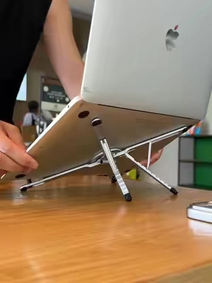 One stand for your phone, iPad and laptop. It fold down small enough to toss in your bag#laptopstand #phonestand #desksetup #workfromhomesetup #stand 