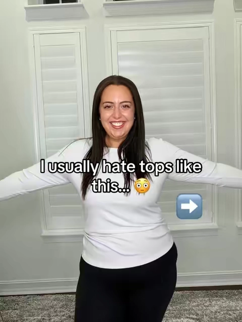 Most fitted tops cling to my stomach and make me feel uncomfortable. This one makes my waist look smaller, flatters my arms, stays full length, and is actually comfortable enough to wear all day. I’m wearing the XL - my regular size. 