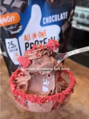 Chocolate Strawberry Soft Serve🍫🍓Recipe below👇 Save this because it tastes like a chocolate covered strawberry! So rich, delicious, and decadent in every bite! Don’t forget to grab a bag of @ShopFlavCity Chocolate Protein on TikTok Shop so you can make it!  Ingredients:  1 cup frozen strawberries  1 ¼ cups half & half 2 scoops FlavCity Chocolate Protein Smoothie  Freeze-dried strawberries for garnish 4 ice cream cones *optional Directions:  In a shaker bottle add the half & half and the FlavCity Protein Smoothie and cover tightly with the lid. Shake vigorously for at least 20 seconds until combined.  To a Creami freezer container add a heaping cup of frozen strawberries and top with the protein mixture until you reach the max fill line. Cover and freeze on a flat surface for a minimum of 6 hours or overnight.  The next day, remove the container from the freezer and remove the lid. Place the open container into the outer container, cover it, and lock it onto the Ninja Swirl Creami machine. Press the ‘soft serve’ button and then select the ‘ice cream’ setting and spin it only once.  Then remove the outer container from the machine and take out the inner container. Cover the inner container with the special soft serve lid, then attach it on the soft serve side of the machine. Hold an ice cream cone or a bowl underneath the dispenser and pull the lever to serve your delicious treat. Garnish with freeze-dried strawberries and enjoy! #tiktokshopsummersale #weeklydeals #protein #icecream #homemadeicecream 