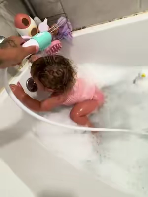 This is perfect for bath time for your little one! Frida control the flow bath sprayer! Sick of filling cups over and over! #frida #controltheflow #bathtimeessentials #bathtimehacks #summerwins 