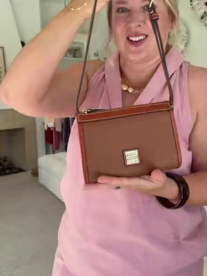 The Dooney & Bourke East West handbag is that timeless everyday bag you’ll reach for again and again. Featuring beautiful pebble leather, a classic east west silhouette, organized interior pockets, and an easy crossbody design, it’s the perfect mix of polished style and everyday function. #DooneyAndBourke #EastWestBag #LeatherHandbag #CrossbodyBag #qvc @QVC, Inc 