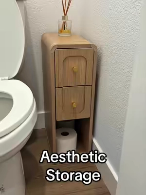 POV: You finally found the storage solution that actually fits in those awkward bathroom spaces. 🤎🚽 This slim storage cabinet keeps extra toilet paper, wipes, and bathroom essentials neatly tucked away while adding a modern touch to your space. Small footprint, big organization—exactly what every bathroom needs! ✨ Slim design for tight spaces ✨ Hidden storage keeps counters clutter-free ✨ Modern wood finish that looks high-end  #storages #storageunitfinds #furniturefinds #storagesolutions #bathroomstorage 
