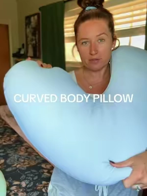 Apparently my bedtime routine was just rearranging 6 pillows until I found this 😂 This curved body pillow is SO cozy for side sleeping and gives you that surrounded-by-pillows feeling without needing half the bed covered in them. 💤 #BodyPillow #SideSleeper #ergonomicpillow 