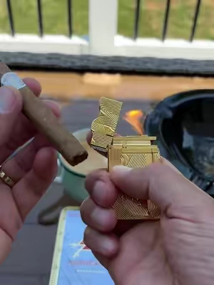 Lighting a post lunch Montecristo stick with the beautiful and elegant Dupont Golden Sanji lighter, paired with an espresso of course! #sanjilighter #fliplighter #coollighters #espressotime #creatorsearchinsights  