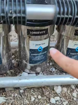 Living in a travel trailer means you get a lot of different types of water. Using a water filter is so important for protecting your hoses and pipes from build up. #waterfilter #rvliving #traveltrailer 