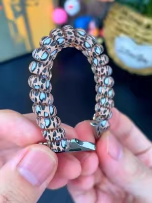 Soft elastic leopard print scrunchie band makes your Apple Watch look stylish without squeezing your wrist. #LeopardWatchBand #AppleWatchBand #ScrunchieWatchBand #AppleWatchAccessories #ChicWearable 