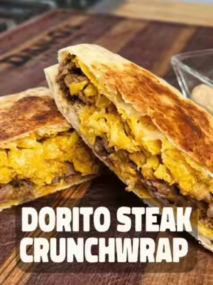 Craving a Crunchwrap but don't feel like hitting the drive-thru? 🌮🔥 This Dorito Cheesy Sirloin Steak Crunchwrap has everything you love, crispy Doritos, melty cheese, seasoned sirloin steak, and a whole lot of Dan-Good flavor. Best part? You know exactly what's going into it... and you won't be stressing about whatever's going on with the lettuce this week. 😂🥬 Skip the drive-thru and make one that's bigger, cheesier, and loaded with steak. Get the full recipe here: Ingredients 1 lb Sirloin Steak Dan-O’s Spicy Seasoning to taste ½ cup grated white cheddar cheese ½ cup grated mild cheddar cheese 4 tbsp crema 4 tbsp Sriracha Dan-O’s Chipotle Seasoning to taste Cool Ranch Doritos, crumbled up 10” flour tortillas 6” flour tortillas Preparation Instructions Sirloin: Heat a skillet over medium - high heat Dice the sirloin roughly Add the diced sirloin to your skillet Season sirloin with Dan-O’s Spicy and proceed to brown Once browned, add your grated cheese and combine together Remove from heat, and set aside. Sauce: In a bowl mix together crema, Sriracha, and Dan-O’s Chipotle Set aside Build Crunchwrap: Microwave tortillas for 15 to 25 seconds so they’re flexible On a flat surface lay out the 10” tortilla and layer the bottom with crumbled Doritos Next, add the sirloin and cheese mixture and then top with your sauce Top with 6” tortilla and fold the sides of the 10” tortilla so it covers the edges Preheat a skillet to medium heat and place crunchwrap folded side down. Cook 2 minutes Flip the tortilla and brown other side for 2 minutes Remove from the skillet and slice in half Serve with remaining sauce, enjoy!