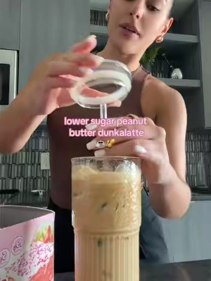 this and a prime bite 🥜🤌 recipe: 1 tsp maple syrup 2 tbsp powdered peanut butter pinch of flaky sea salt 1 shot espresso 1/2 cup fairlife milk add maple syrup, powdered peanut butter, and flaky sea salt to the bottom of a glass jar and brew espresso over it. add ice to the jar and shake. pour over ice, add milk, and enjoy! ☕️  #dunkalatte #macrofriendly #peanutbutterlatte 