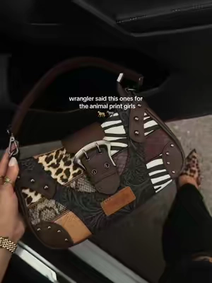 this new print is everything  #wrangler #purse #pursetok #animalprintlover 