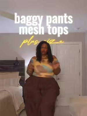 Here’s the outfit formula for looking styled without sacrificing comfort: fitted top + dramatic baggy pants. 🤎 The off-the-shoulder mesh top keeps the upper half fitted and feminine, while the oversized pants add movement, personality, and plenty of room to breathe. It’s the kind of balance that keeps a relaxed outfit from looking accidental. Wear this for brunch, a concert, vacation, a creative event, or any casual day when regular pants feel a little too boring. Would you recreate this look with heels or sneakers? Tap the 🛒 to shop #outfitideas #casualoutfits #baggypants #croptop #curvyfashion 