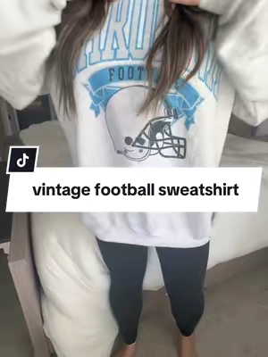 Game day just got a whole lot cozier. 🏈 This vintage-inspired football sweatshirt is the perfect oversized layer for tailgates, Friday night lights, crisp fall mornings, and all your football season traditions #footballseason #gamedayoutfit #fallfashioninspo #footballmom #cozyseason @PartyOnShop 