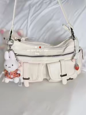 angel kiss bags are the cutest! always have so much space, & so many places to hang bag charms ★ #angelkissbag #y2kbag #y2kstyle #pursetok #cutebag 
