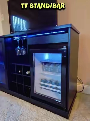 Enhance your living area with this TV and bar setup. It includes a convenient fridge, making it perfect for entertaining. Currently on sale—don't miss out! #LivingRoomGoals #BarCart #HomeUpgrade #SpecialOffer #fyp