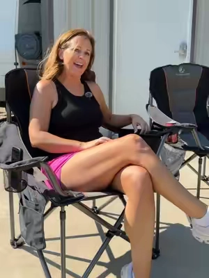 These oversized camping chairs give you plenty of room to relax, plus a built-in beverage cooler so your drink is always within reach. #campinggear #campingchair #outdoorliving #tailgating #campingessentials 