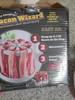 Cook up to a pound of bacon right in the microwave without it sitting in all that grease. The Bacon Wizard hangs each strip so the grease drains into the tray, helping the bacon cook crisp while making cleanup much easier. It also folds flat for simple cabinet storage. #MicrowaveBaconCooker #BaconMaker #TikTokShopCreatorPicks #tiktokshopstockup #tiktokshopsummersale 