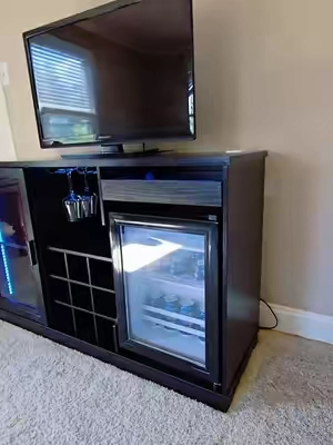 Check out this TV stand featuring a built-in fridge and bar! It's perfect for any living room setup. Don't miss out – limited supply and a limited-time sale! #TVStand #HomeBar #LivingRoomUpgrade #LimitedTimeOffer