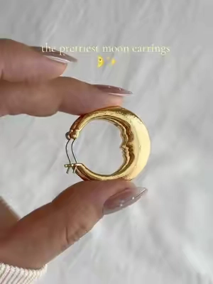 The most whimsical earrings I own 🤩 I’m obsessed with them ✨🌛 #moonearrings #enroutejewelry #cutejewelry #hoops #moon 