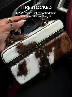 Grab it before it sells out again. #handbag #fallbag #cowprint #luxurybag 