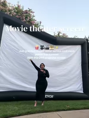 Backyard movie nights just got an upgrade 🍿 This 24-ft inflatable projector screen kit comes with the projector and everything you need & inflates in about a minute for quick set ups 🎬✨ #movielover #movienight #momtok #movietok #familytime 