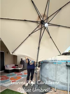 Upgrade your outdoor space with the Garvee 10ft Cantilever Patio Umbrella! This heavy-duty offset sun shade is designed for maximum sun protection and outdoor comfort. Engineered with a rustproof aluminum frame and a heavy-duty, waterproof 600D Oxford canopy, it is built to withstand the elements while keeping you cool all summer. #offsetumbrella #umbrella #patio #backyardvibes #tiktokshopcreatorpicks 