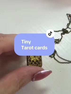 This necklace is such a fun find! Tiny tarot cards!! #tarotcards #tarotreader #necklace #jewelry 