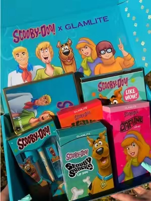 💜🐾 JINKIES…The Scooby-Doo™ x Glamlite collection is officially BACK after selling out multiple times, and if you missed it the first time… this is your sign. 👀💚💜 From the iconic 25-color palette to the Velma & Daphne Lip Kits, the Scooby Snacks Lip Care Duo, mirror, makeup bag, and more… the Mystery Inc. glam squad is back together. ✨  What’s back: 💜 Scooby-Doo™ x Glamlite 25 Color Palette  🤎 Scooby-Doo™ Lip Kit 💄 Daphne Lip Kit  📚 Velma Lip Kit  🩷 Scooby Mirror  🍪 Scooby Snacks Lip Care Duo  💚 Mystery Machine Makeup Bag  Don’t come back saying “ruh-roh” when it’s gone because we warned you. 🐶💚