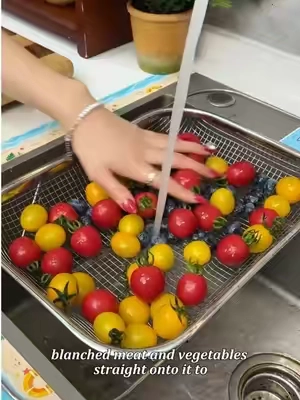 Placing this retractable stainless steel drying basket over the sink makes washing vegetables, fruits, and dishes so convenient! It fits both large and small sinks. #RetractableDryingBasket #VeggieWashingBasket #KitchenEssentials #DealsForYouDays #tiktokshop