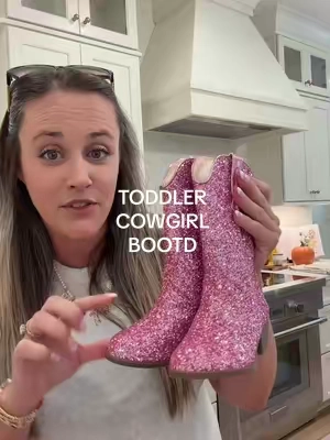 The cutest little pink sparkle cowgirl boots for all the girly outfits 💕 Such a fun toddler girl fashion find for fall outfits, dresses, denim, and everyday looks. #toddlergirlstyle #girlmomfinds #pinkboots #toddlerfashion #tiktokshopfinds @Topshoes 