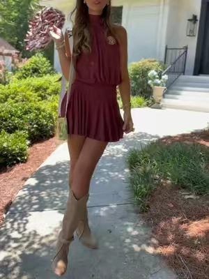 The perfect little mini dress for gameday or concerts!! Love the built in shorts! I’m 5’8 135 wearing a small. @Cider #gamedayoutfit #minidress #romper #halterdress #CollegeFootball 