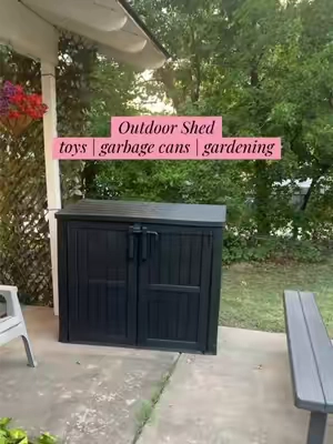 We LOVE this shed for aesthetic, backyard storage! I also love the idea of concealing garbage cans with it!  #shed #outdoorstorage #backyardliving #patioseason #backyarddesign 
