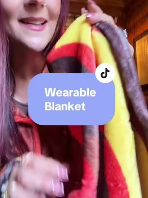 This warm and cozy wearable blanket is seriously so cute! So warm and the perfect movie watching blanket! #wearableblanket #blanket #blanketseason 