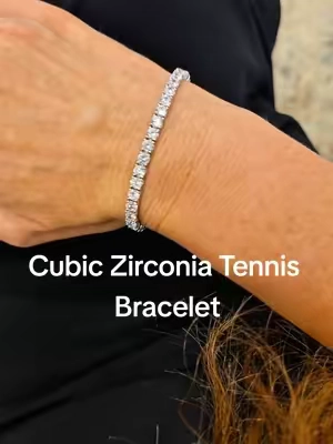 Classic round-cut cubic zirconia tennis bracelet available in multiple stone sizes and bracelet lengths. Size shown here: 4mm, 7 inches  #TennisBracelet #CubicZirconia #CZJewelry #BraceletStack #EverydayJewelry @MDFUN JEWELRY 