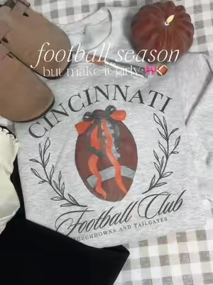 Okay but a coquette football sweatshirt?? 🎀🏈 I’m obsessed. #FootballSeason #tiktokshopcreatorpicks #Footballsunday #GameDay #TikTokMadeMeBuyIt