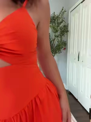 the orange in this jumpsuit is a whole moment 