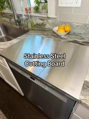With three sizes to choose from this stainless steel cutting board is the smart choice for every kitchen. #stainlesssteel #cuttingboard #kitchenessentials #kitchenmusthaves #TikTokshopbacktoschool 
