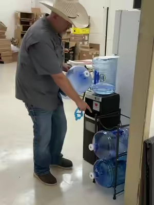 This water jug rack is a great way to store these 5 gallon water jugs #waterjugrack #jugrack #watercoolerjug #watercoolerjugrack 