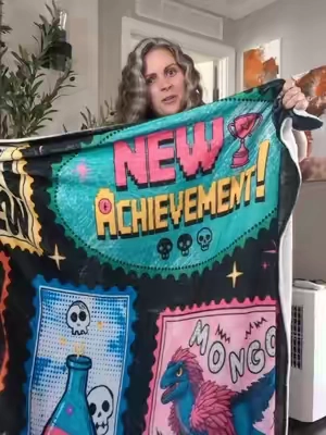 This DCC blanket is not only soft but it's perfect for the book lover in your life #dcc #dungeoncrawlercarl #BookTok #TikTokshopbacktoschool 