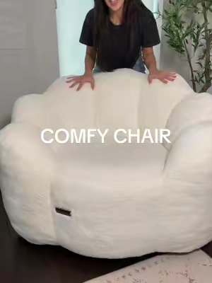 Fluffy, cushy chair that everyone fights to sit in. Perfect for lounging around, book reading, or movie watching. Love and want another 🤍🤍🤍 #comfychair #loungechair #beanbagchair #homefurniture #cutechair 