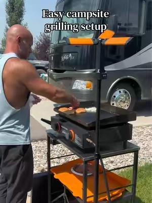 Our favorite camping grill table!! We searched EVERYWHERE for a table that could handle our grills while taking up minimal storage space.  #rvaccessories #outdoorcooking #grillingseason #tailgateszn #rvlife 