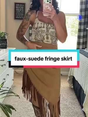 This faux-suede fringe skirt is made for boots + a good country playlist. 🤎 The high waist, asymmetrical hem, and long fringe give it that western look with tons of movement. #fringeskirt #cowgirlstyle #westernskirt #tiktokbacktoschool #suedeskirt 